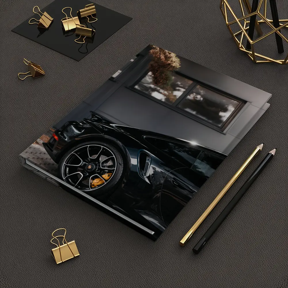 Black Porsche 911 Parked Near Building – Notebooks