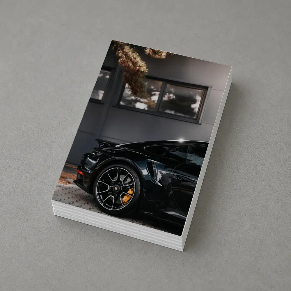Black Porsche 911 Parked Near Building – Postcards