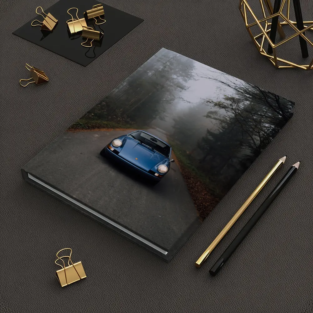 Blue Porsche 911 on Foggy Forest Road – Notebooks
