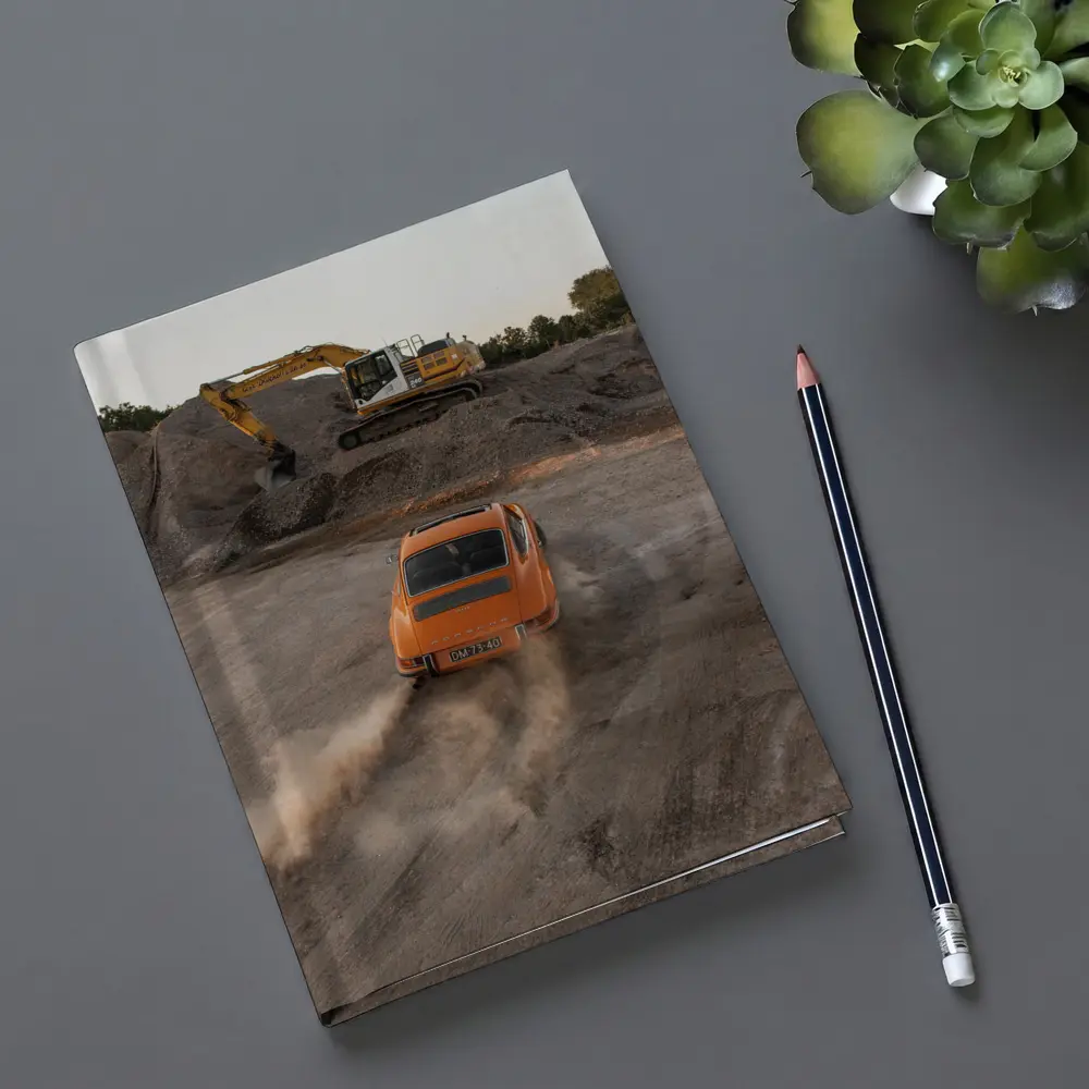 Orange Porsche 911 Drifting Dusty Gravel Quarry – Notebooks