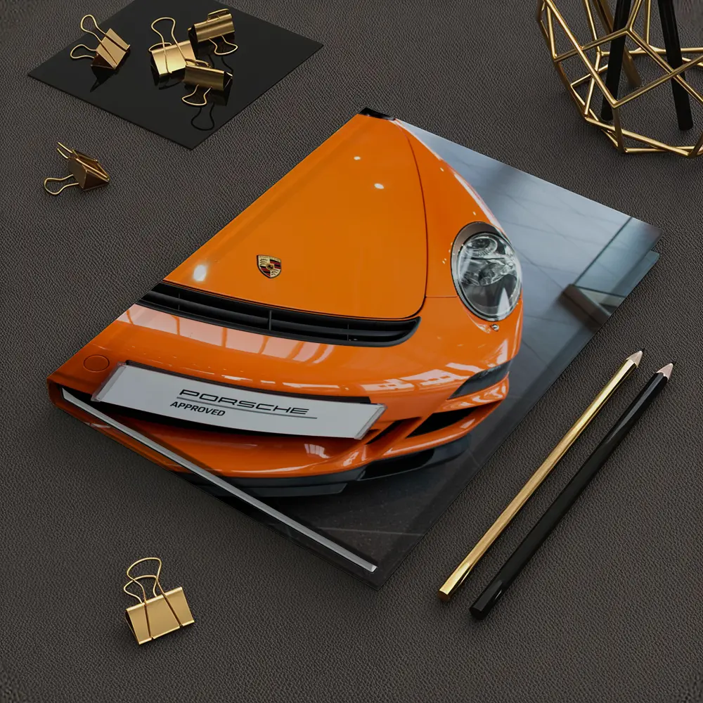 Porsche 911 Orange Front Dealership Interior – Notebooks