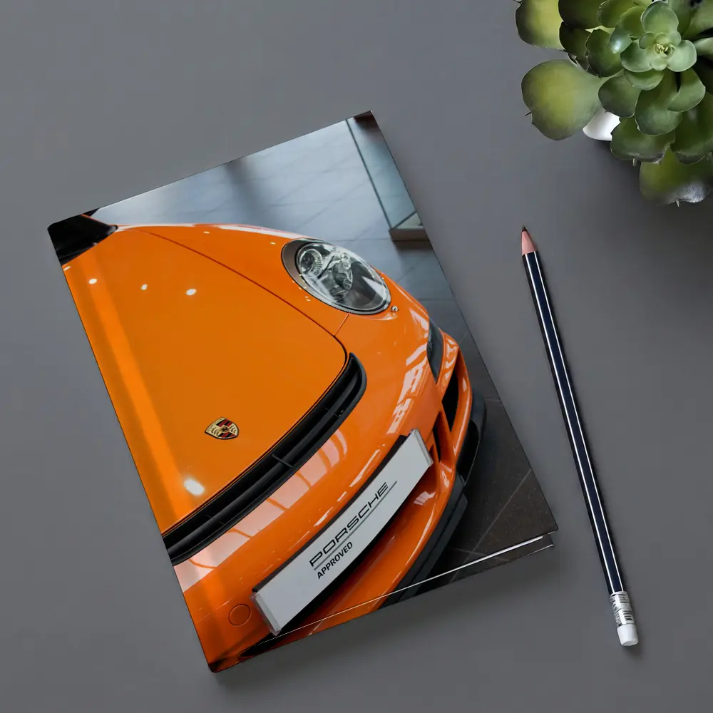 Porsche 911 Orange Front Dealership Interior – Notebooks