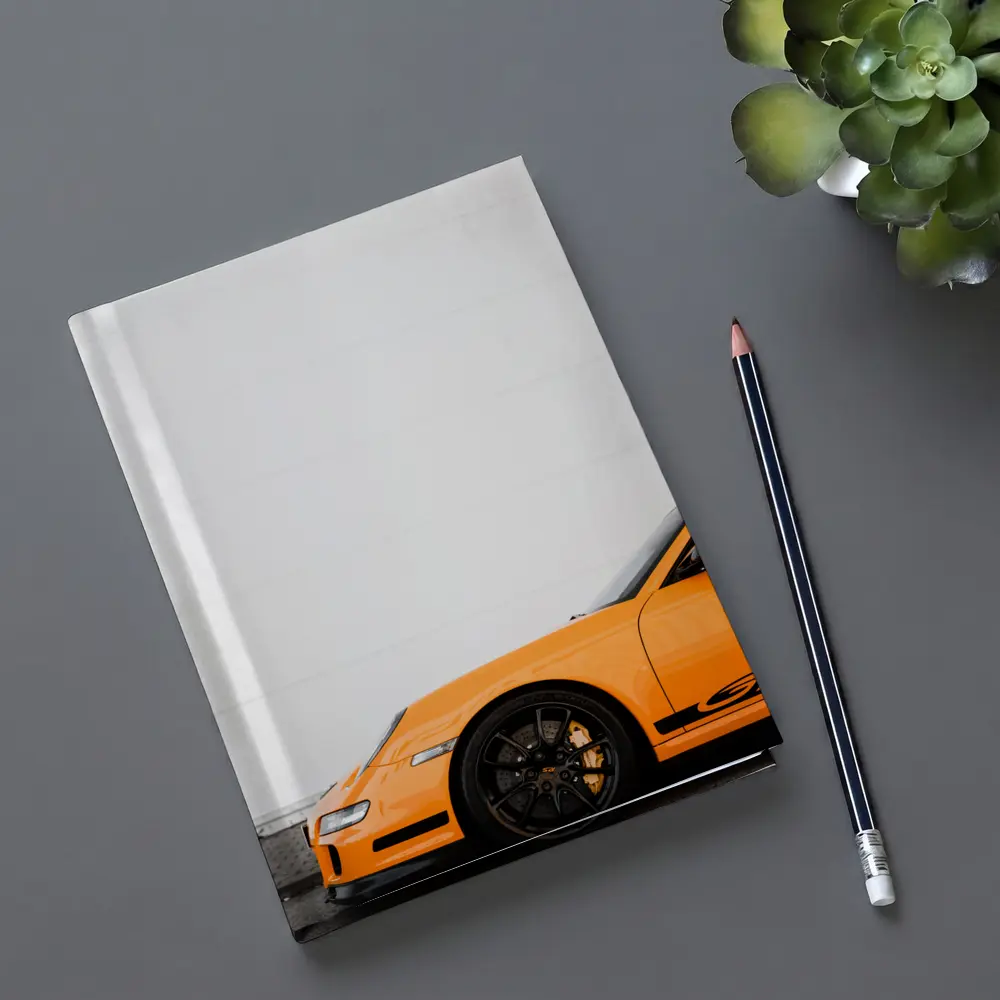 Orange Porsche GT3 Against White Wall – Notebooks