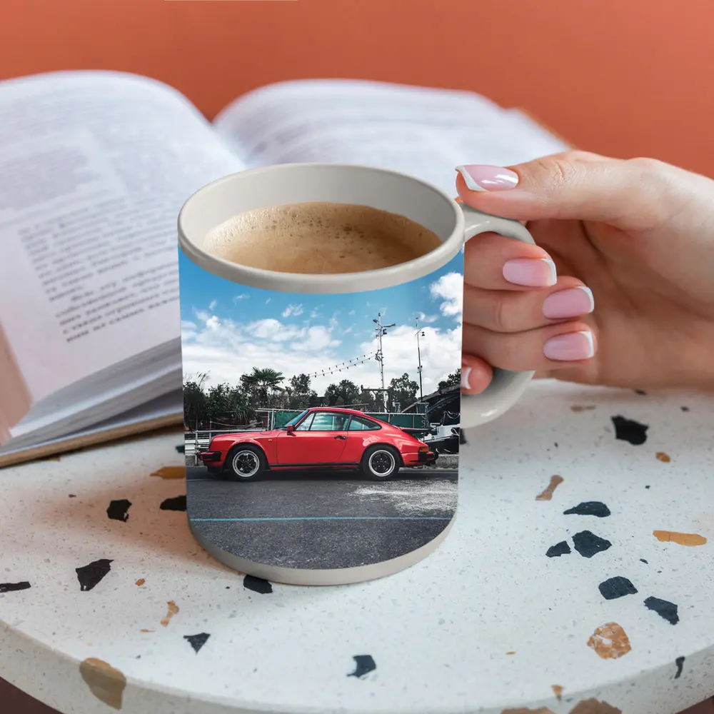 Red Porsche 911 Parked Under Blue Sky – Mugs