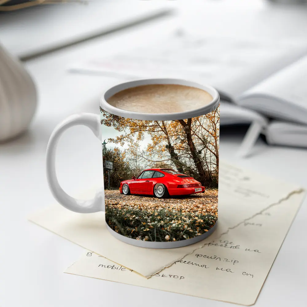 Red Porsche 911 Parked Among Autumn Leaves – Mugs