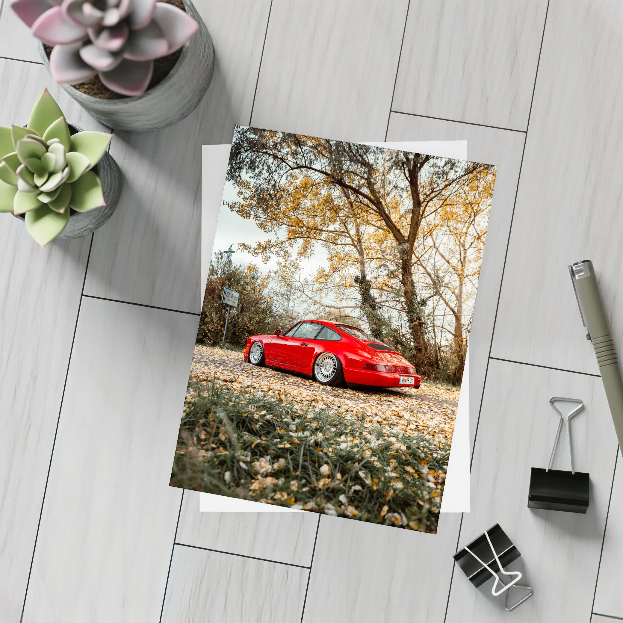 Red Porsche 911 Parked Among Autumn Leaves – Postcards