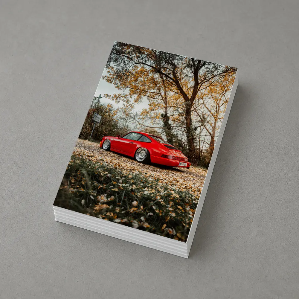 Red Porsche 911 Parked Among Autumn Leaves – Postcards