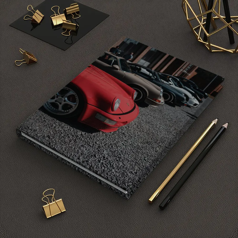 Porsche 911 Fleet Parked Urban Gravel Lot – Notebooks