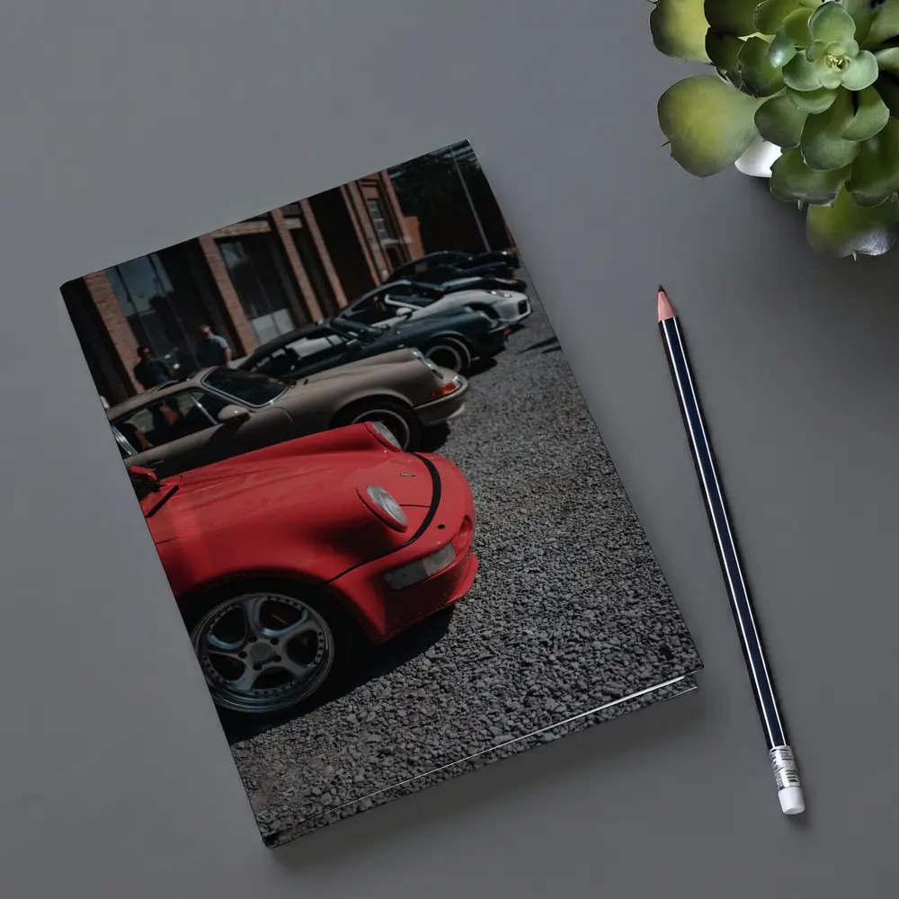 Porsche 911 Fleet Parked Urban Gravel Lot – Notebooks