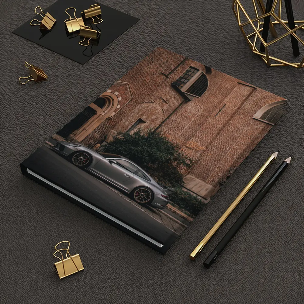 Porsche 911 GT3 Silver Beside Brick Church – Notebooks