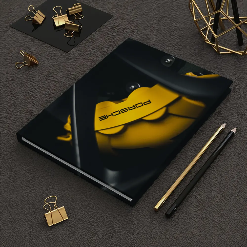 Porsche Yellow Brake Caliper Dark Background – Notebooks