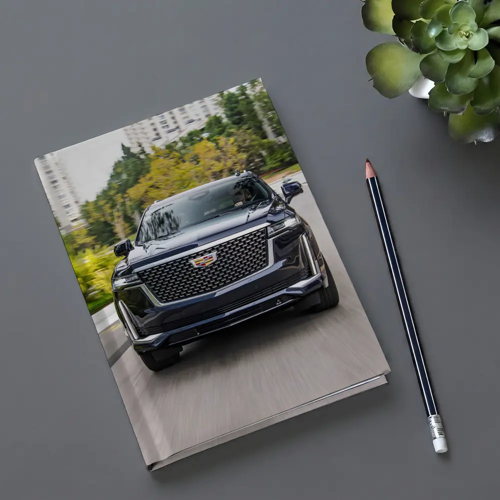 Cadillac Escalade Driving City Street Front View – Notebooks