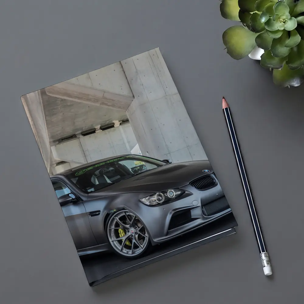 BMW M3 Sedan Matte Gray Under Concrete Bridge – Notebooks