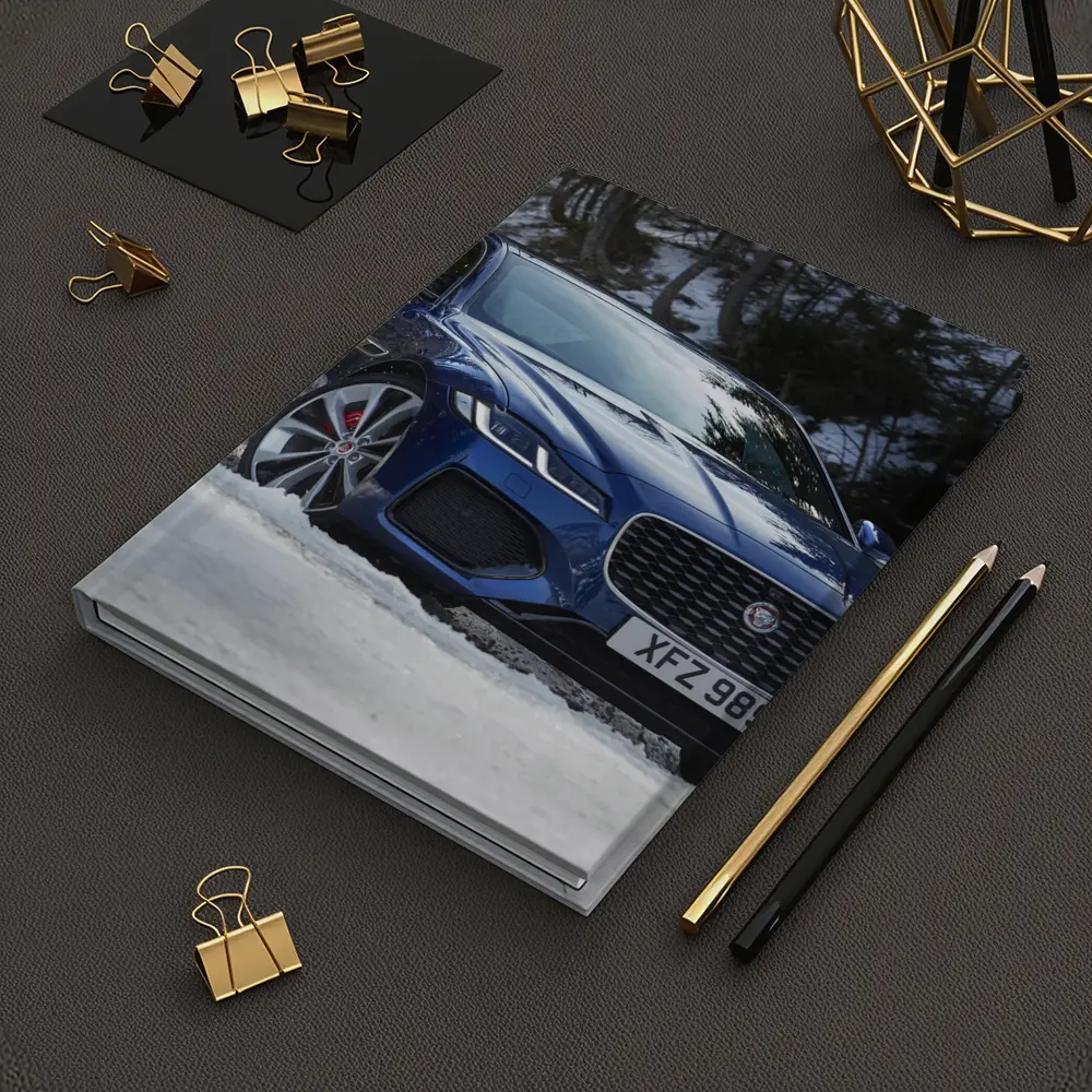 Jaguar XF Blue Sedan Driving Through Snow – Notebooks