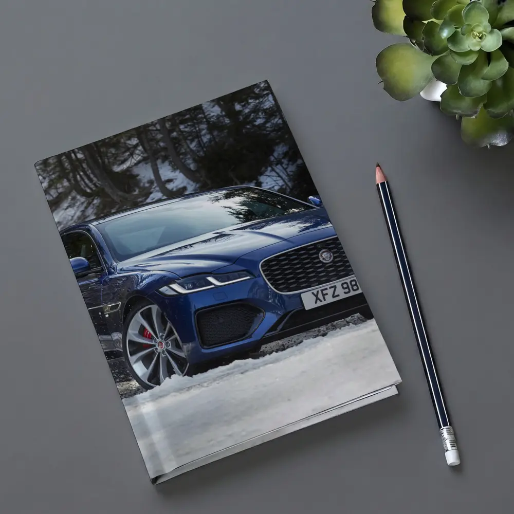 Jaguar XF Blue Sedan Driving Through Snow – Notebooks