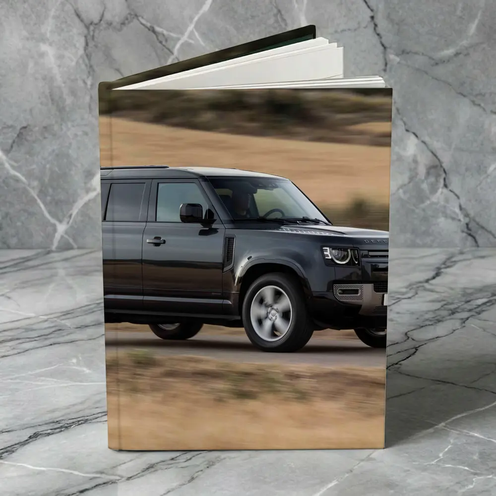 Land Rover Defender Driving Rural Road Scene – Notebooks