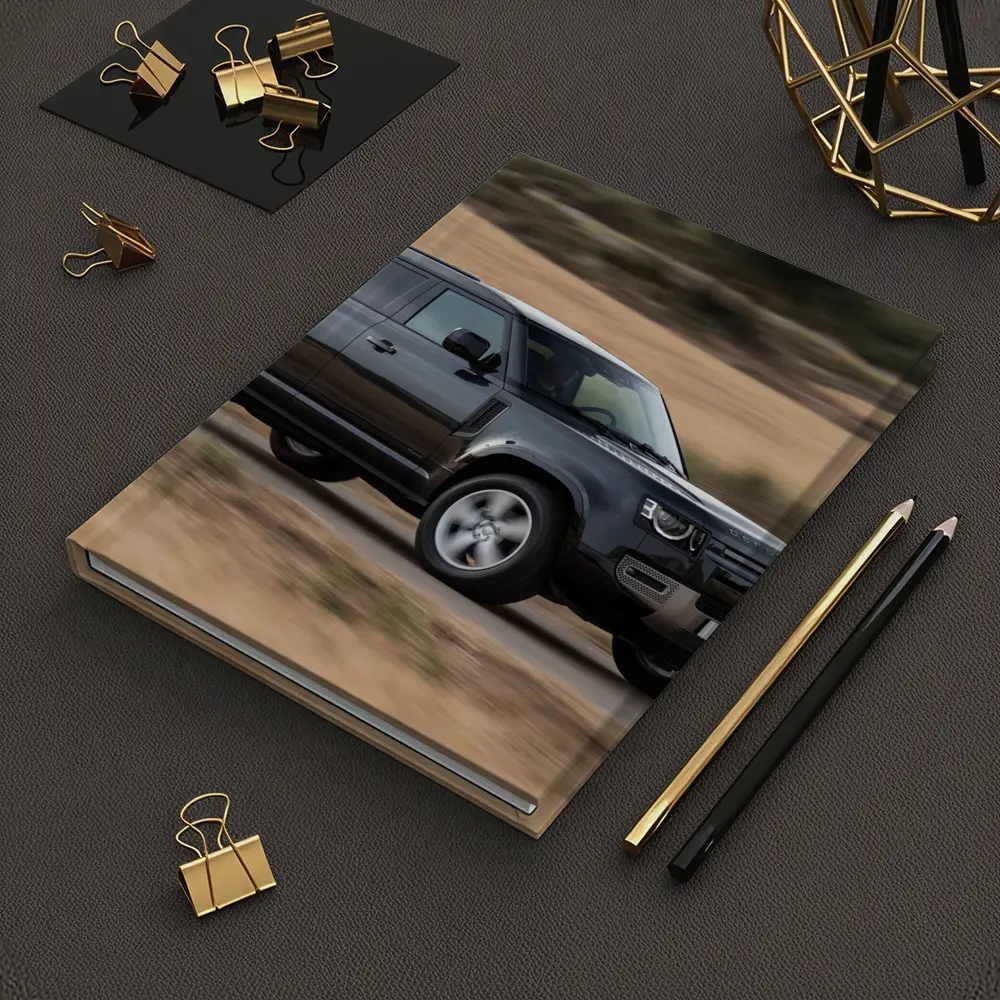 Land Rover Defender Driving Rural Road Scene – Notebooks