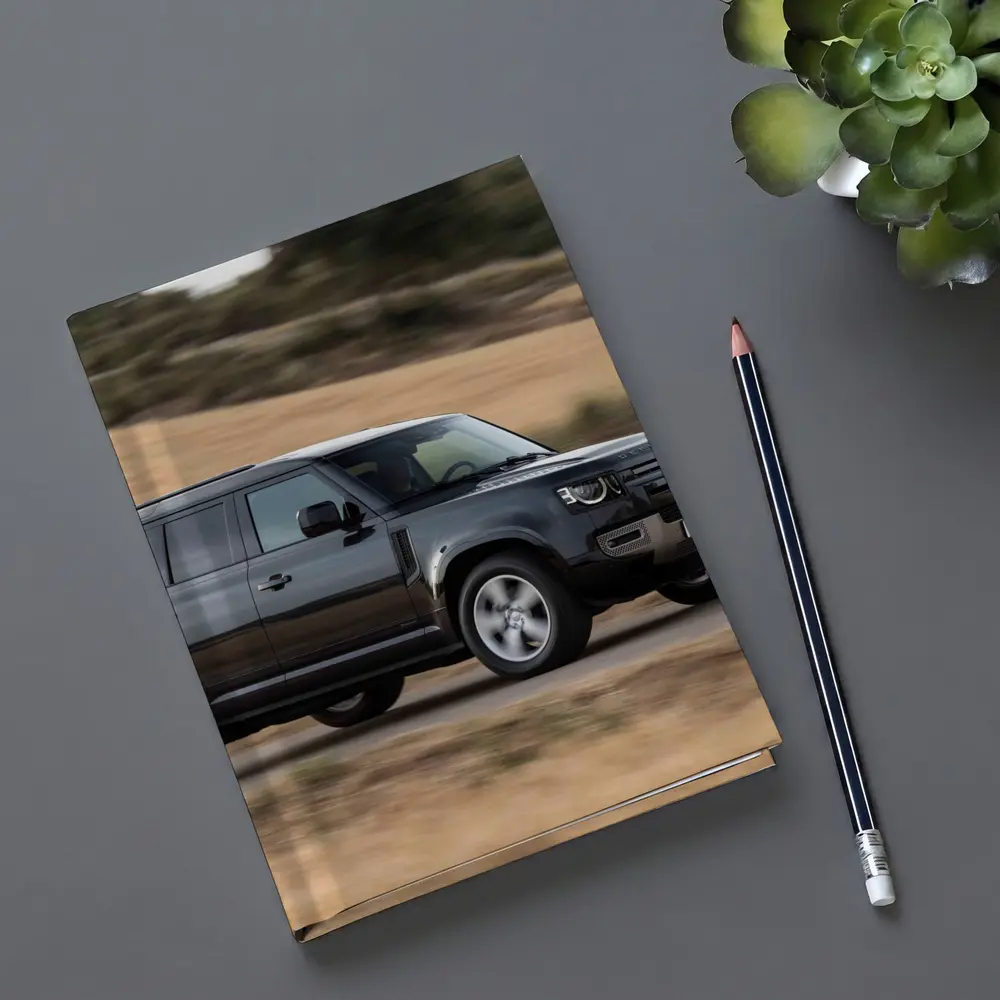 Land Rover Defender Driving Rural Road Scene – Notebooks
