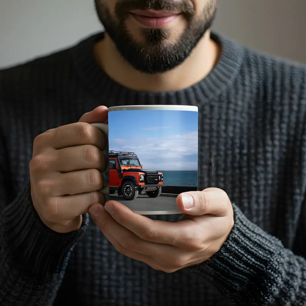 Land Rover Defender Orange Coastal Road Scene – Mugs