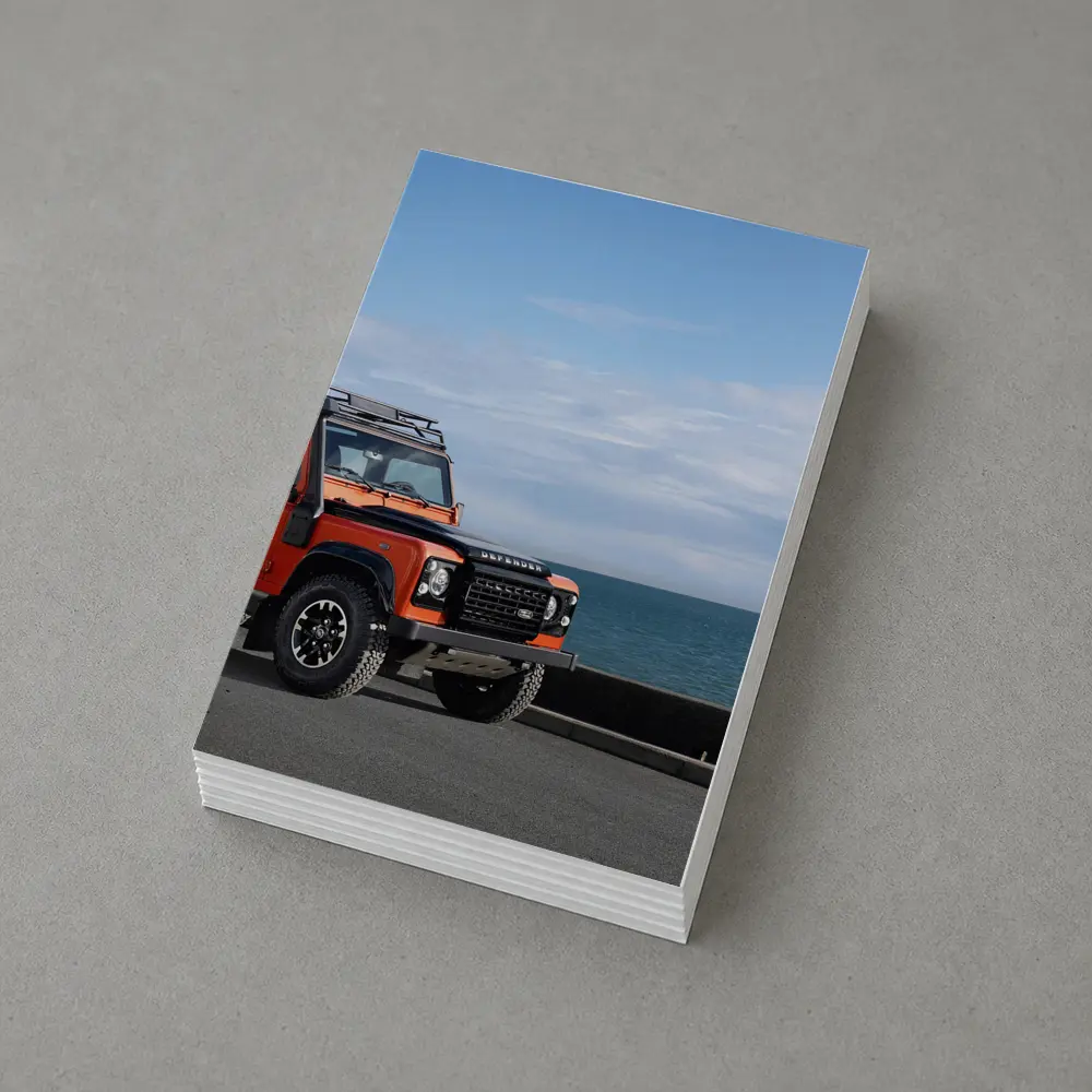 Land Rover Defender Orange Coastal Road Scene – Postcards