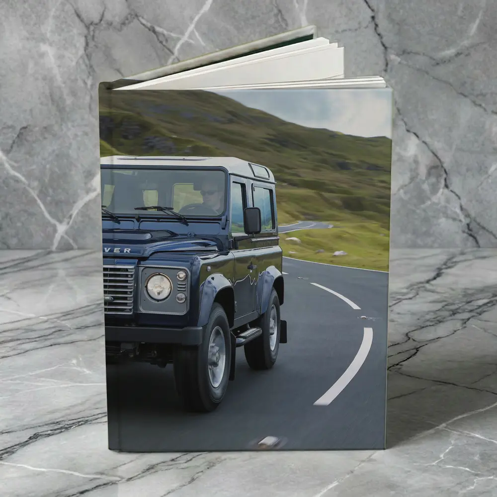 Land Rover Defender Rolling Through Highland Roads – Notebooks