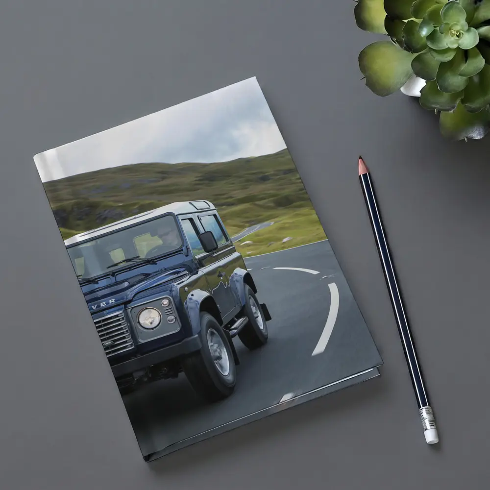 Land Rover Defender Rolling Through Highland Roads – Notebooks