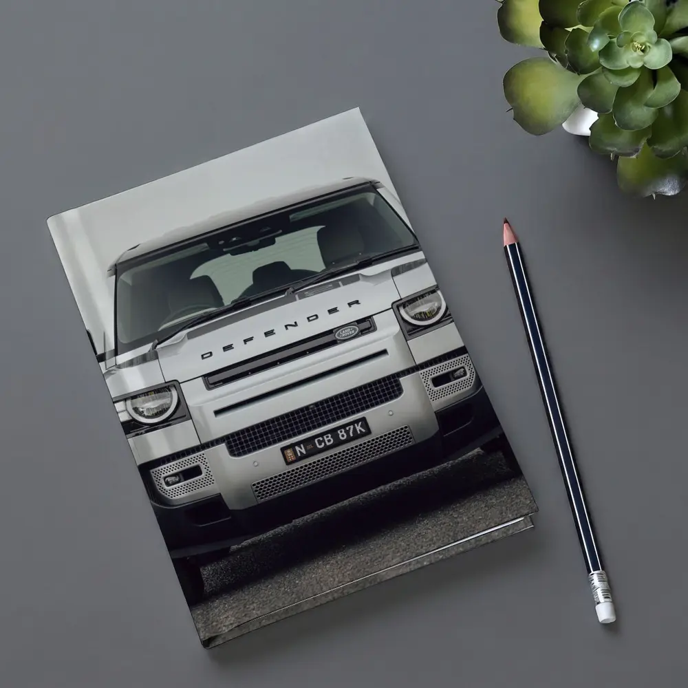 Land Rover Defender Front View Road Background – Notebooks
