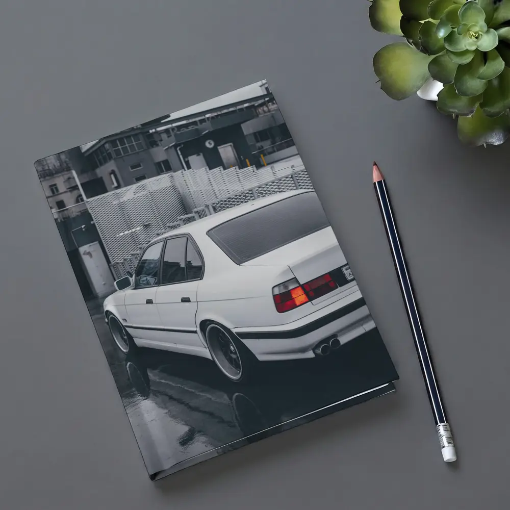 BMW E34 White Sedan Rainy Urban Street – Notebooks