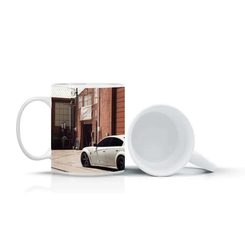 White Dodge Charger Parked Near Industrial Building – Mugs