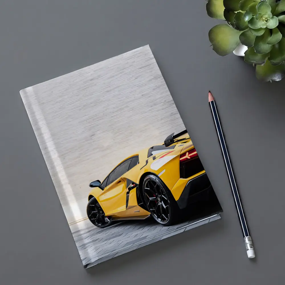 Lamborghini Aventador Yellow Against Concrete Wall – Notebooks