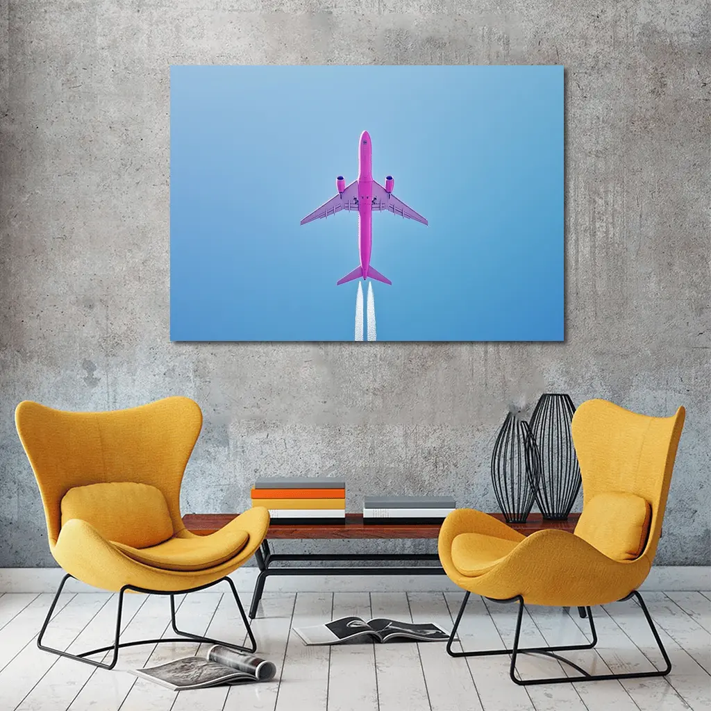 Pink Airplane Flying Against Blue Sky – Wall Art