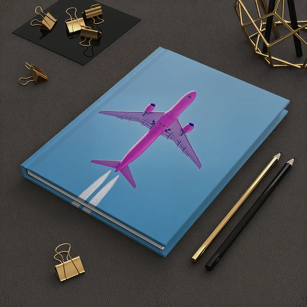 Pink Airplane Flying Against Blue Sky – Notebooks