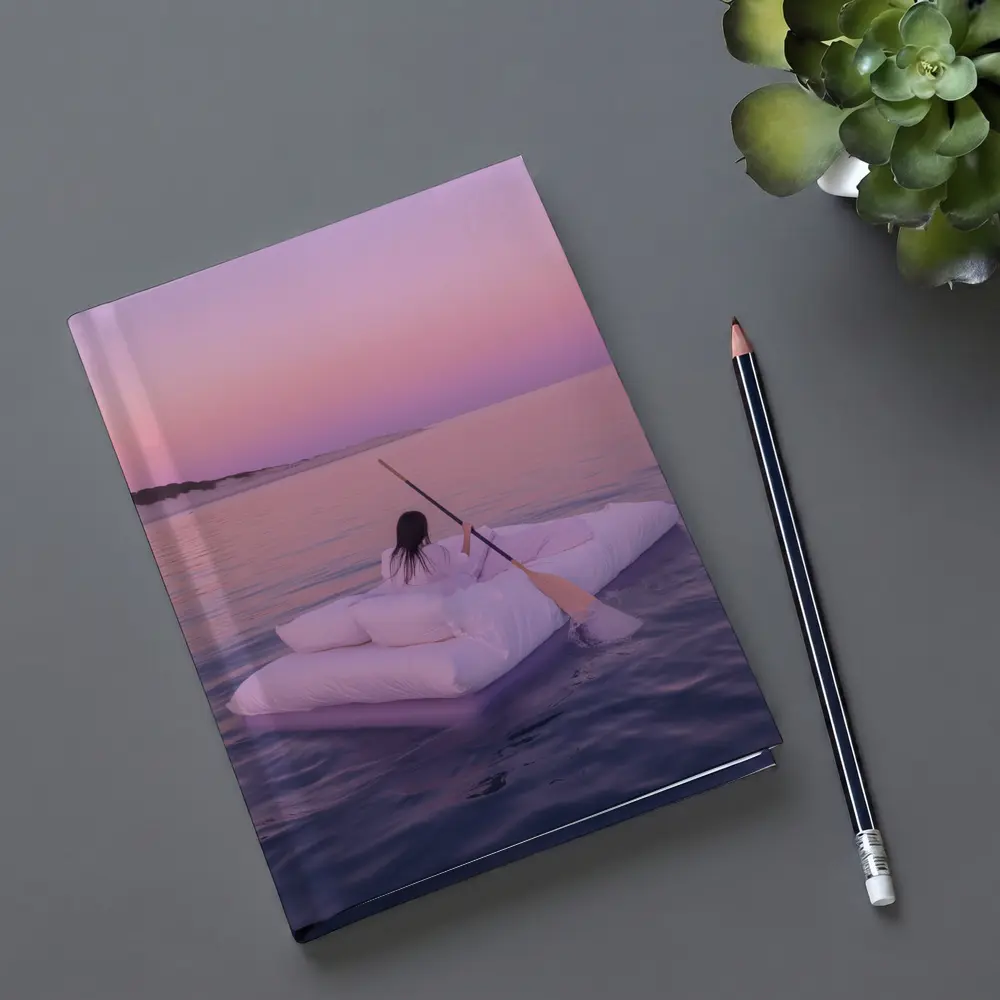 Woman Floating on Raft at Pink Sunset – Notebooks