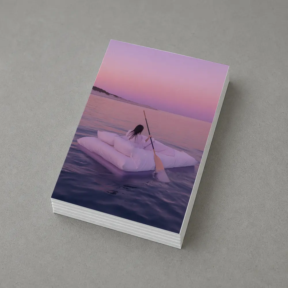 Woman Floating on Raft at Pink Sunset – Postcards