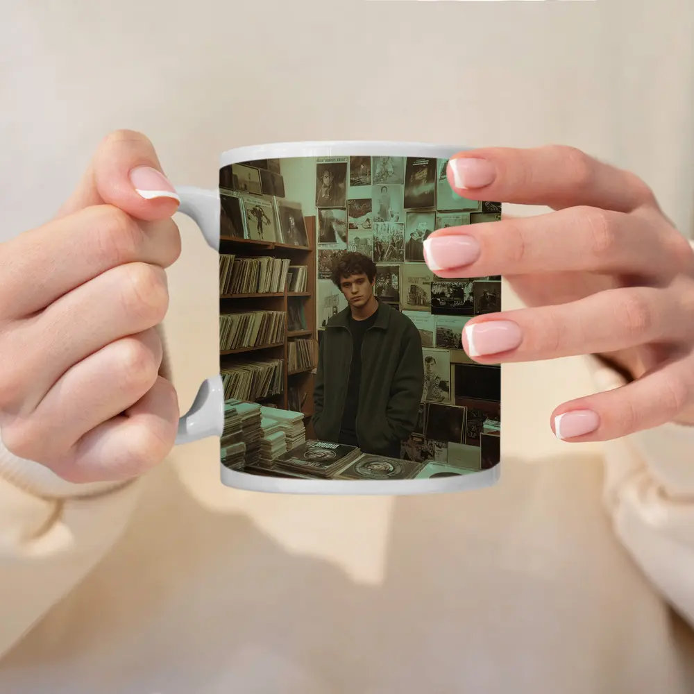 Young Man Standing In Vintage Record Shop – Mugs