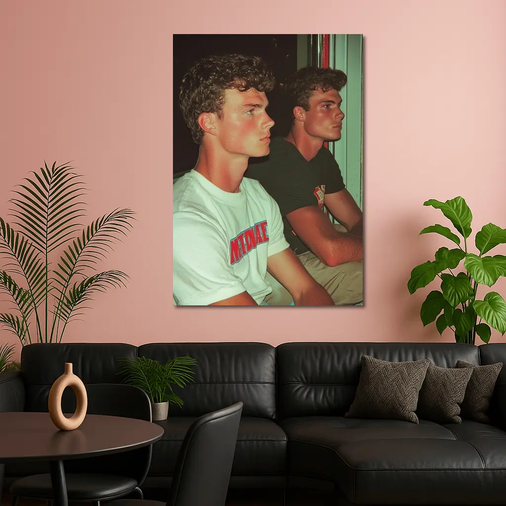 Two Young Men Sitting Together Indoors – Wall Art