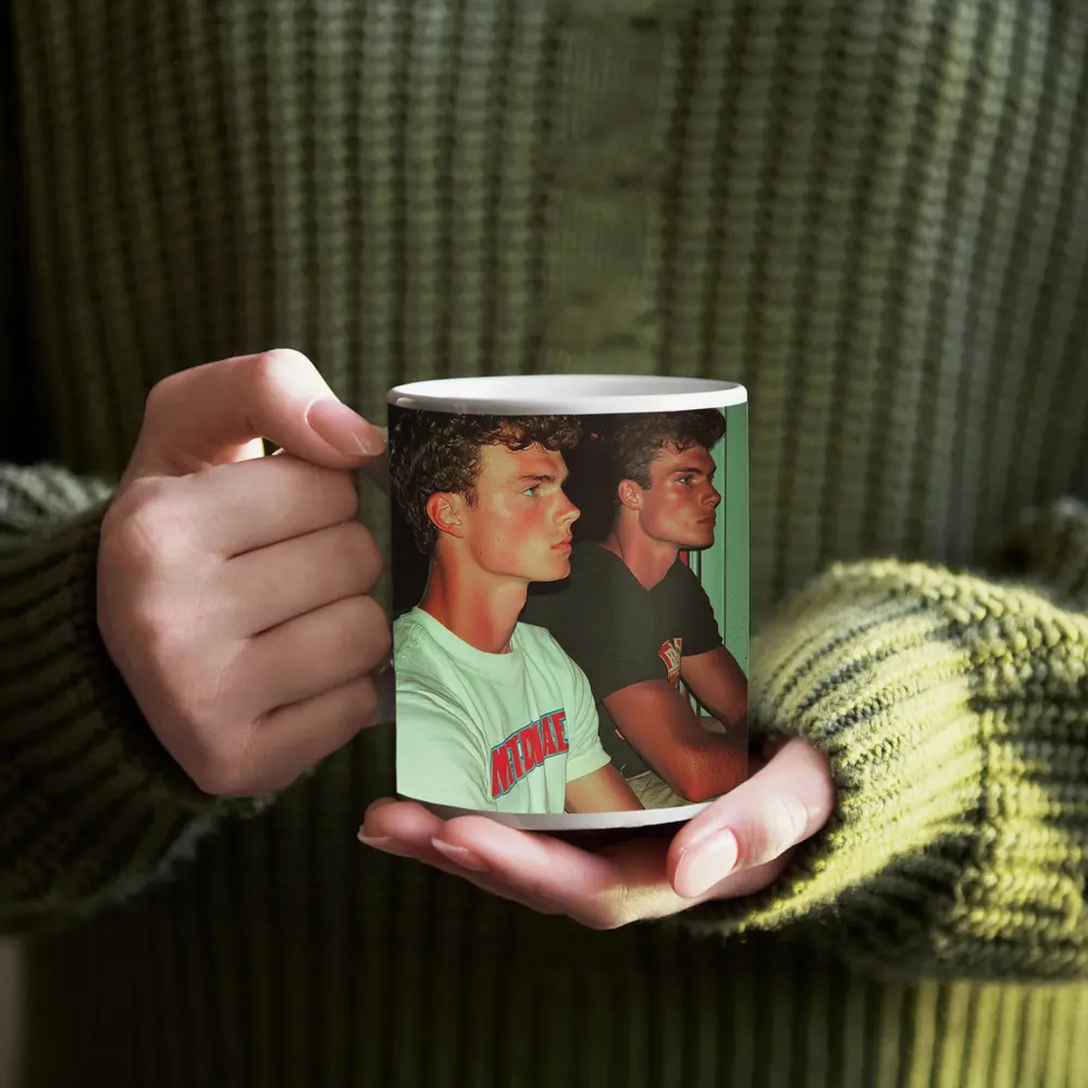 Two Young Men Sitting Together Indoors – Mugs