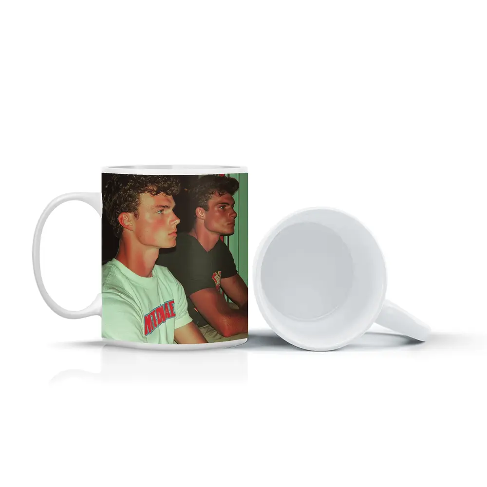 Two Young Men Sitting Together Indoors – Mugs