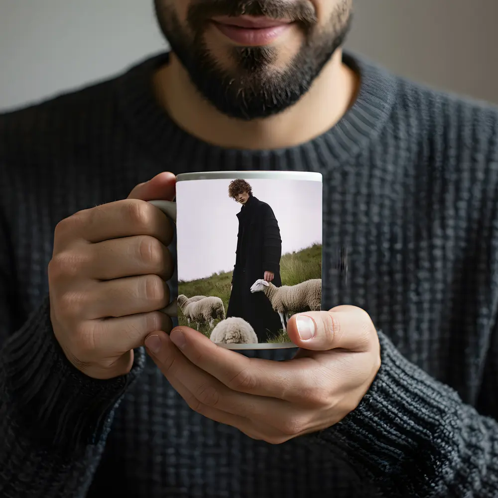 Young Man Black Coat Sheep Green Field – Mugs