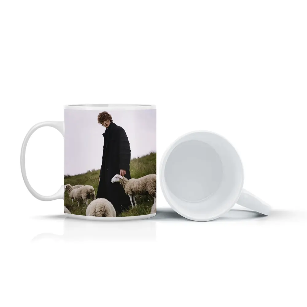 Young Man Black Coat Sheep Green Field – Mugs