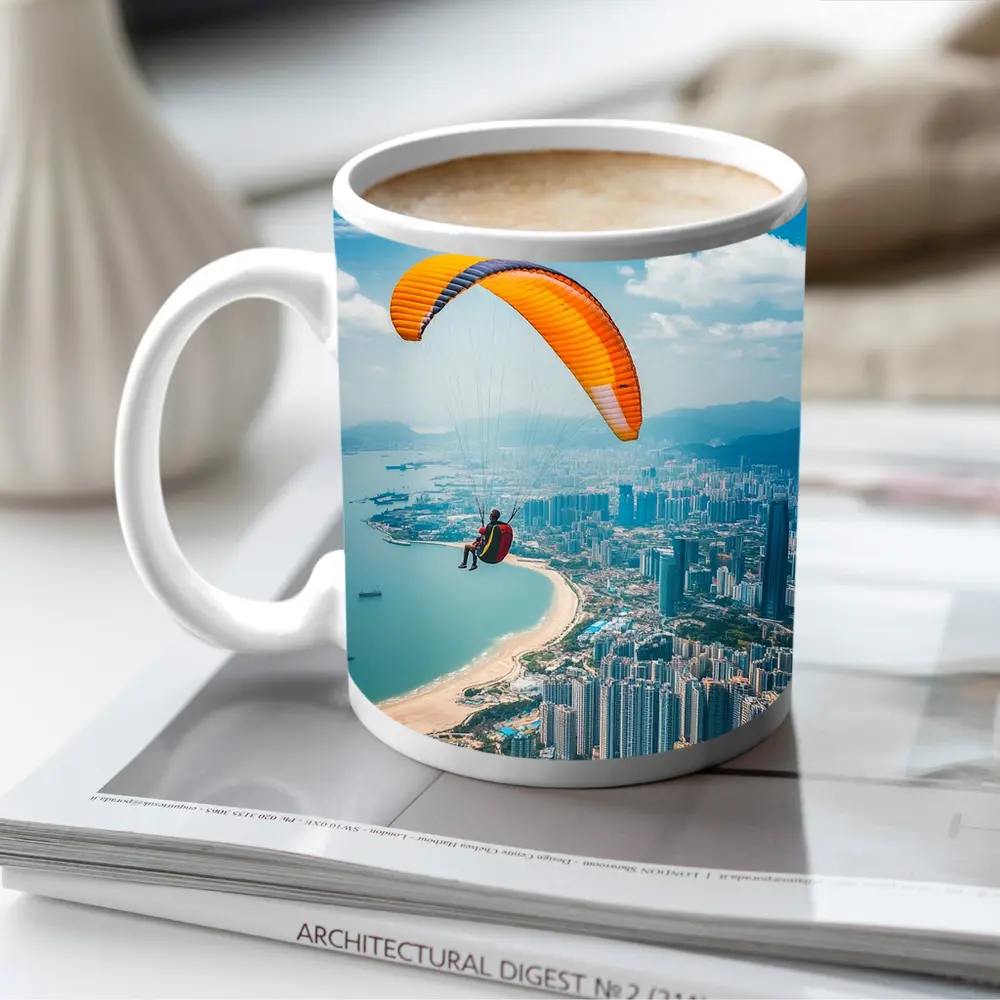 Paraglider Soaring Over Coastal City Skyline – Mugs