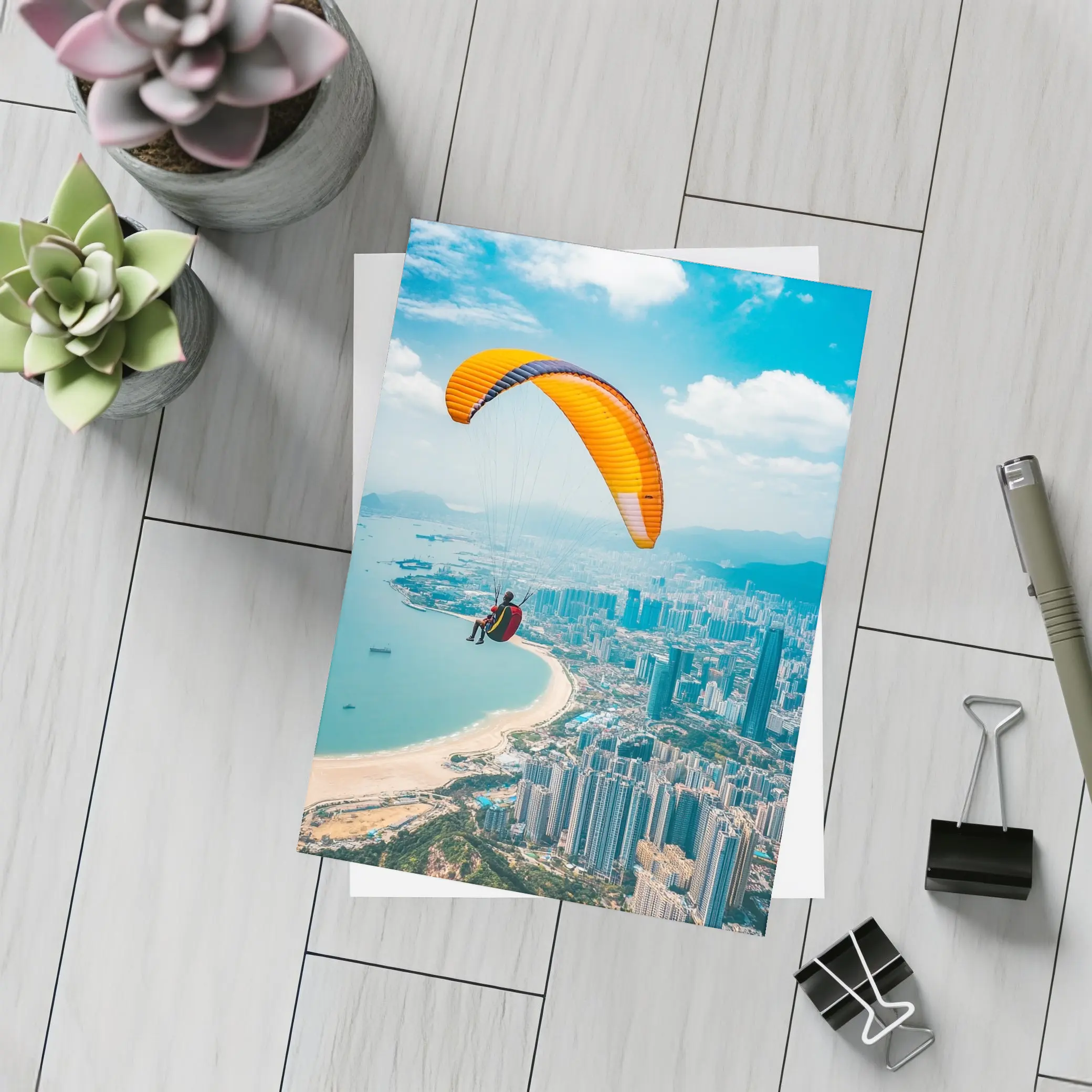 Paraglider Soaring Over Coastal City Skyline – Postcards