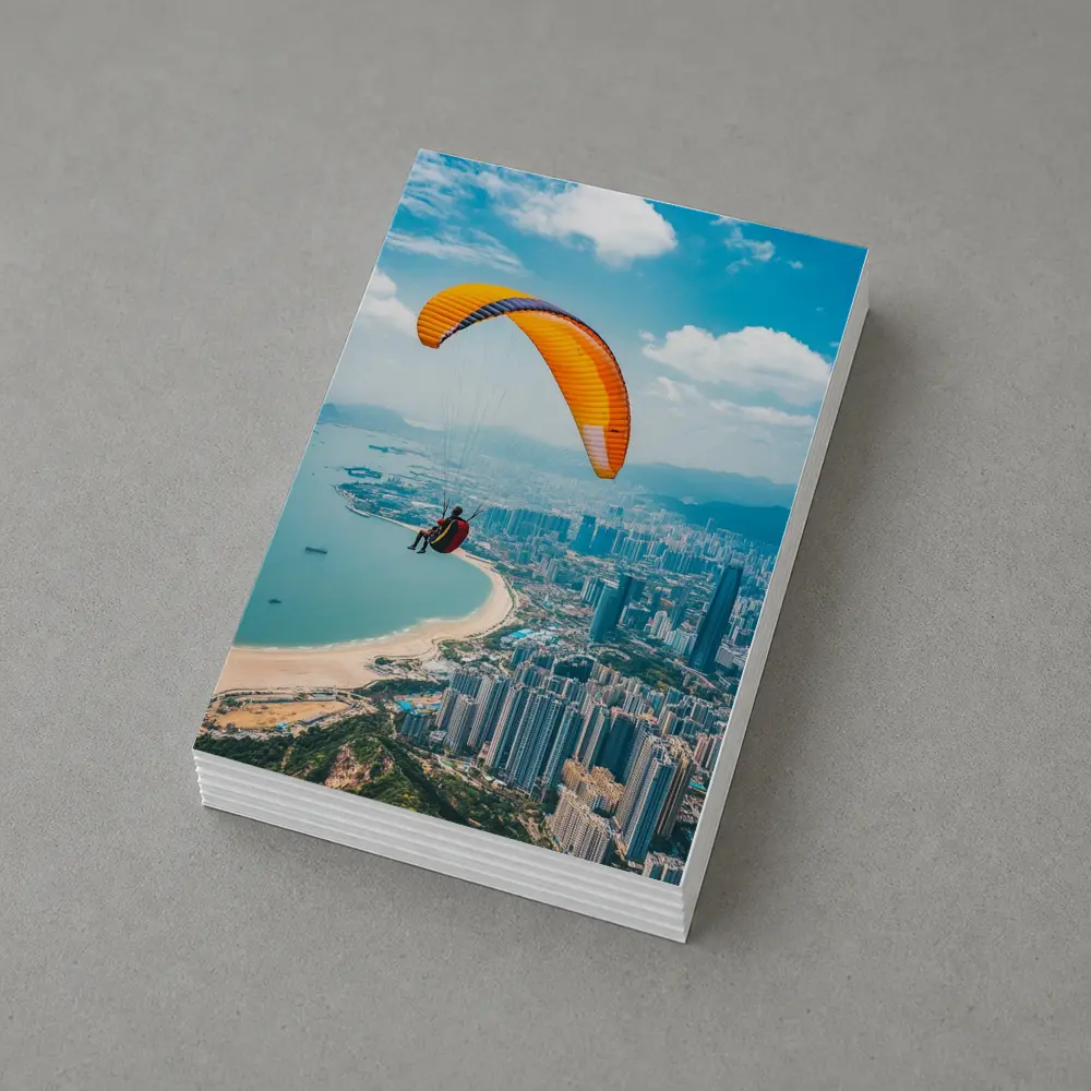 Paraglider Soaring Over Coastal City Skyline – Postcards