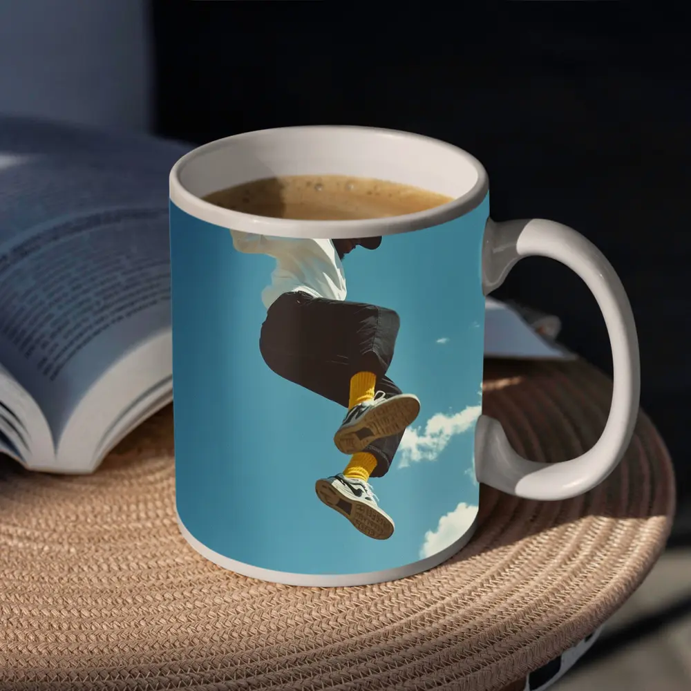 Man Jumping High Against Blue Sky – Mugs