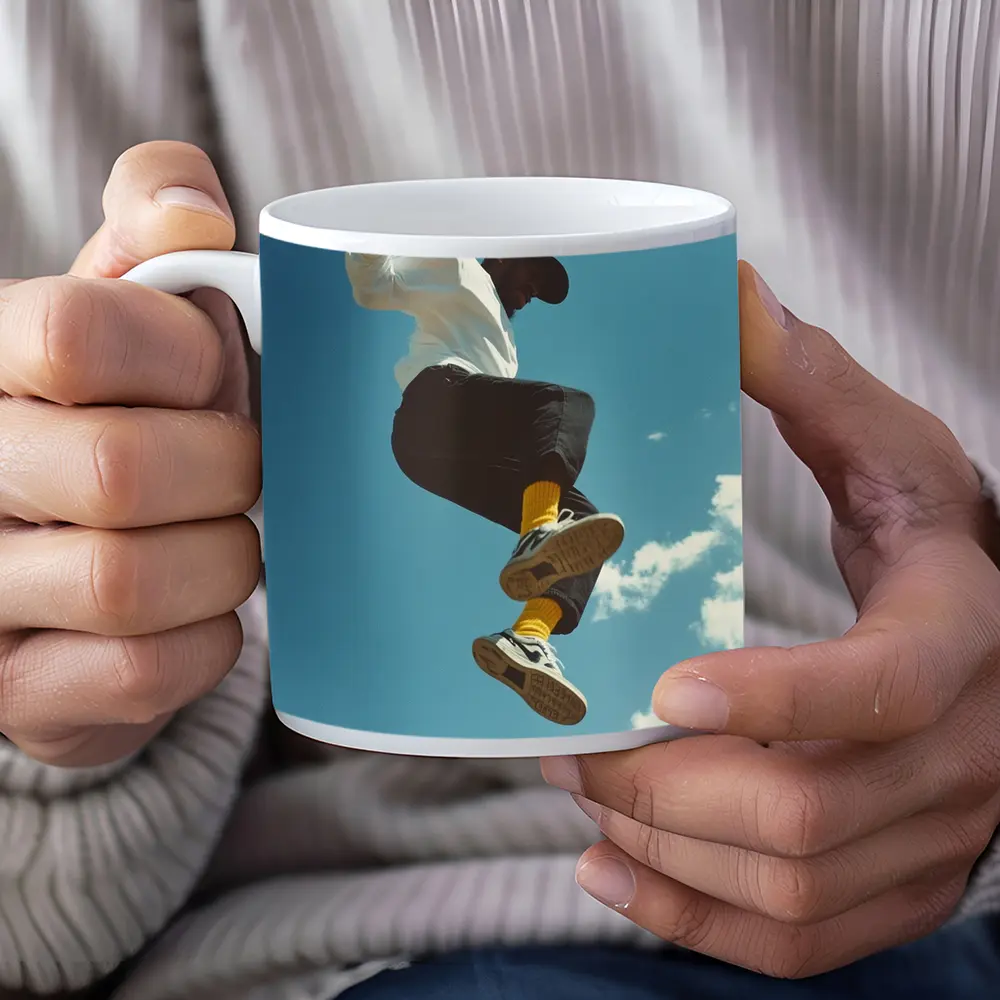 Man Jumping High Against Blue Sky – Mugs
