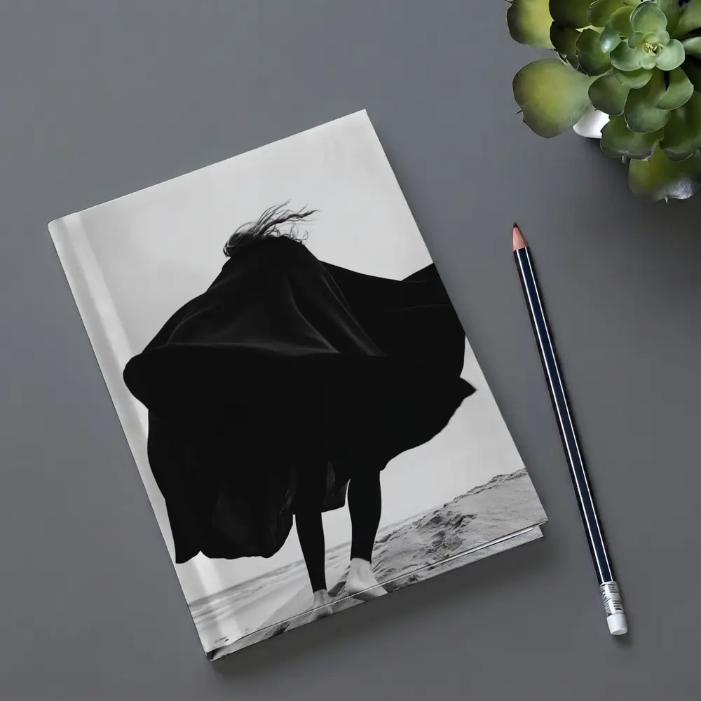 Woman Black Cape Flying Beach Sand – Notebooks