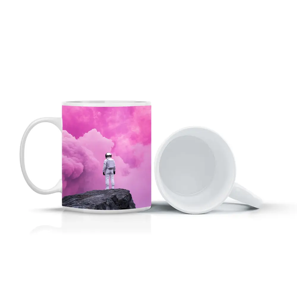 Astronaut Standing On Rock Pink Sky – Mugs