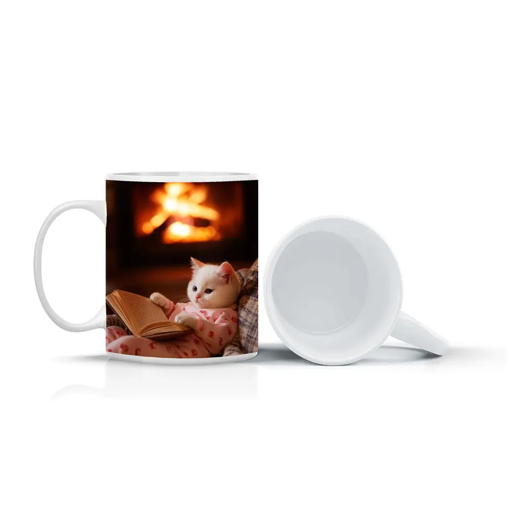 White Kitten Reading Book By Fireplace – Mugs