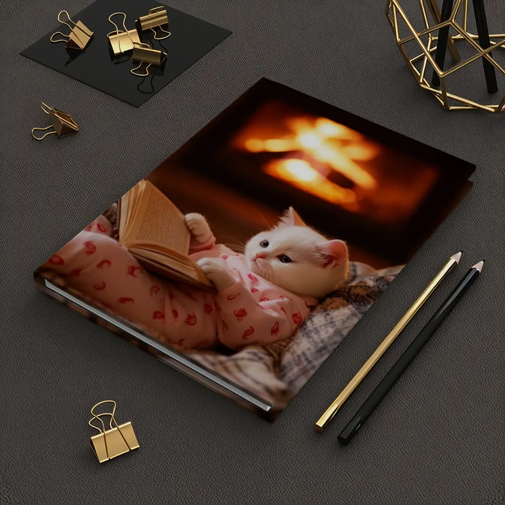 White Kitten Reading Book By Fireplace – Notebooks