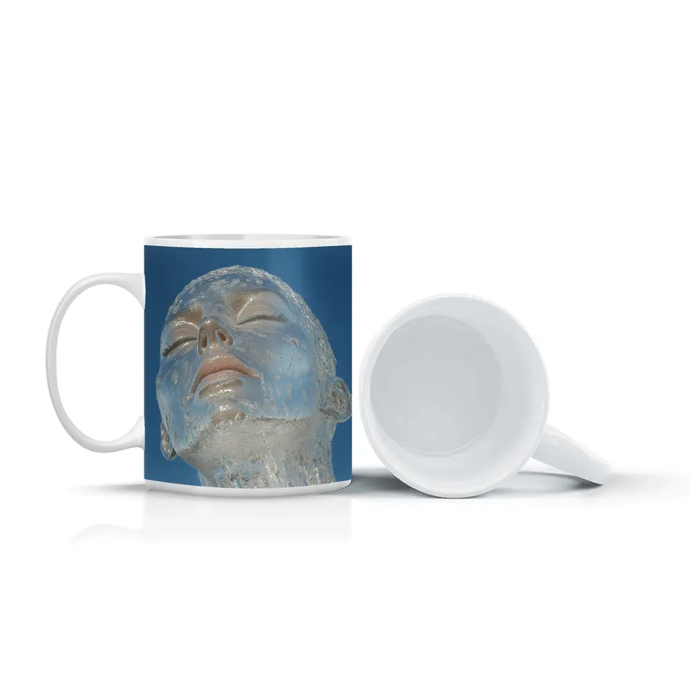 Ice Face Sculpture Against Blue Sky – Mugs